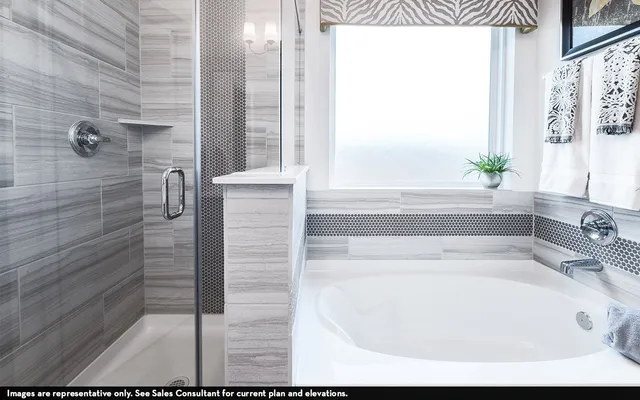 a en suite bathroom with a sink and mirror