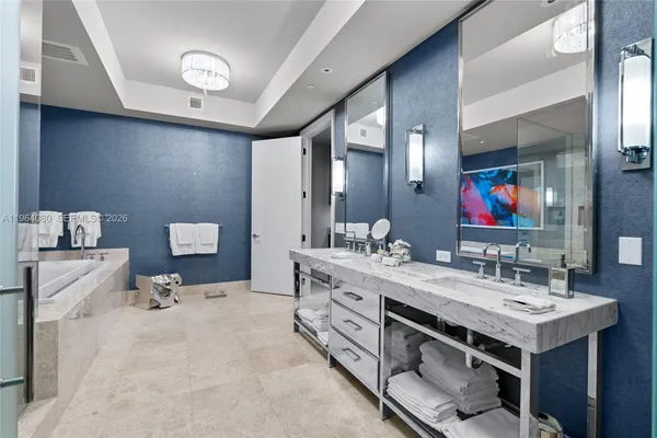 a bathroom with a double vanity sink and a mirror