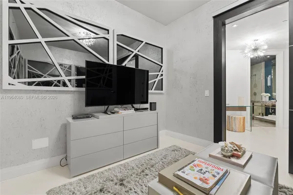 a utility room with multiple dryer and washer