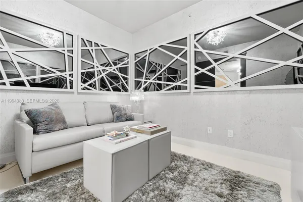 a bathroom with a granite countertop sink a mirror and a shower
