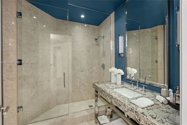 a white toilet sitting next to a white walls