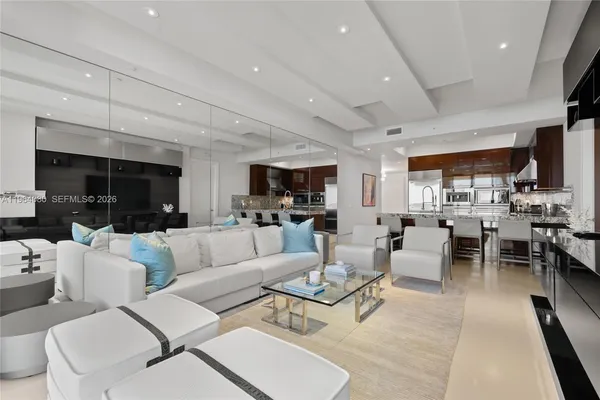 a living room with furniture and a large window