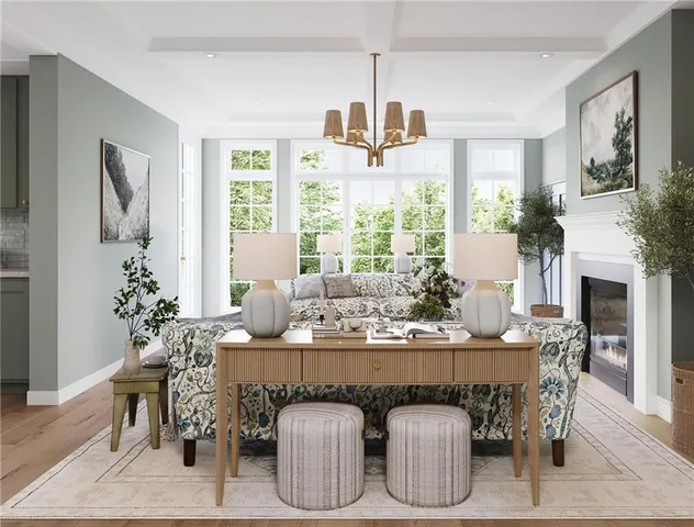 a dining room with furniture a chandelier and window