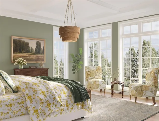 a bedroom with a bed and a chandelier