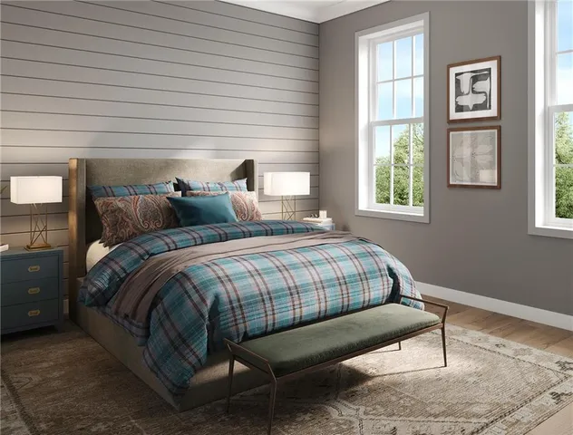 a bedroom with two beds and a window