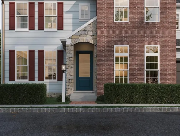 a view of a brick building next to a yard