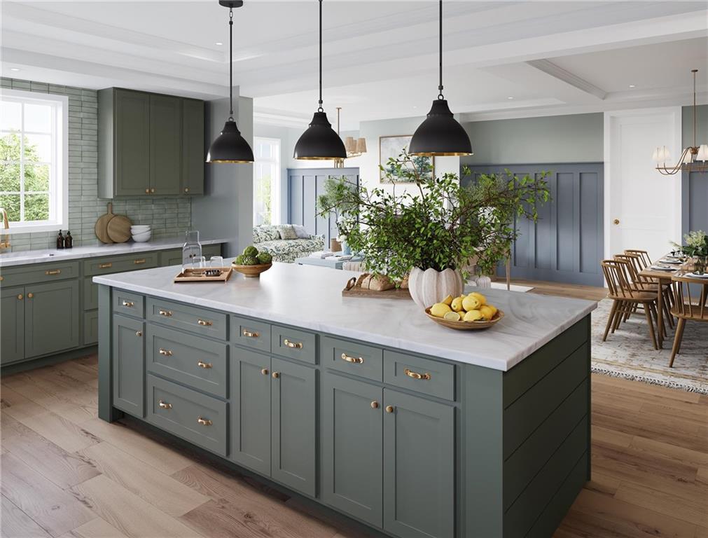 102 Ramsgate Road, Unit CONWAY Cranberry Township, PA 16066 - Photo 5 of 42 a kitchen with a sink a stove and chairs