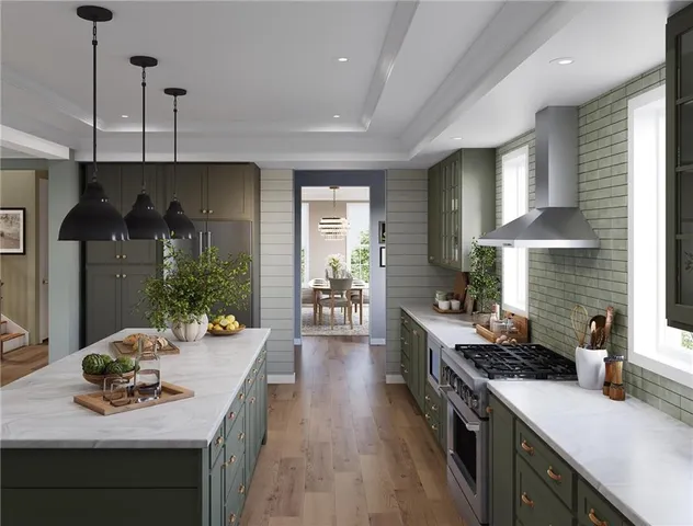 a kitchen with a stove and a wooden floor