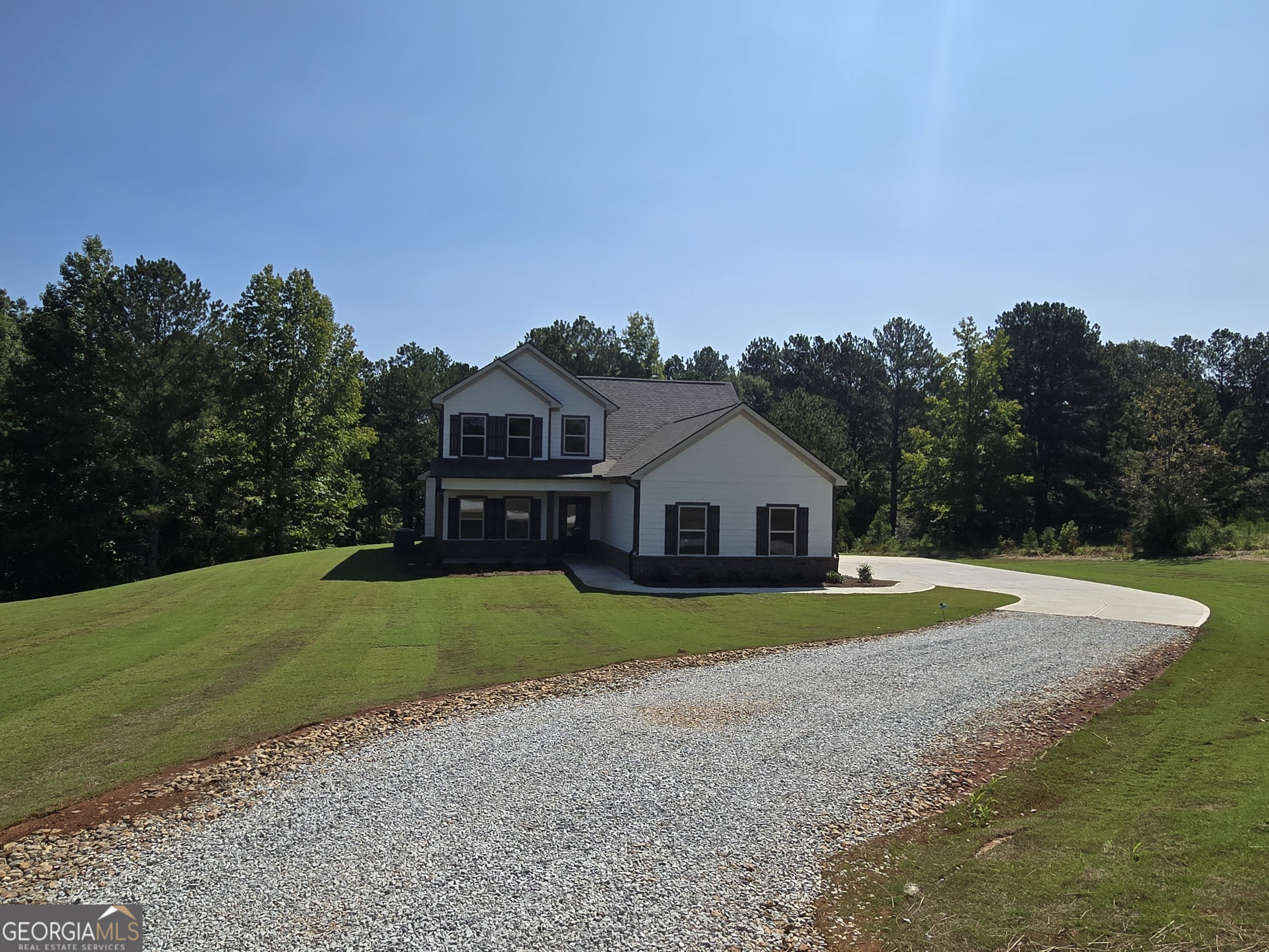 a view of house with outdoor space and trees