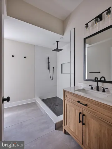 a bathroom with a sink and mirror