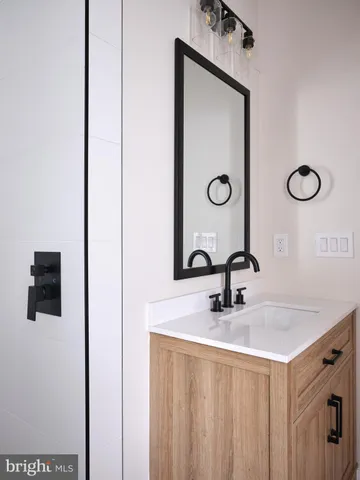 a bathroom with a sink a vanity and mirror