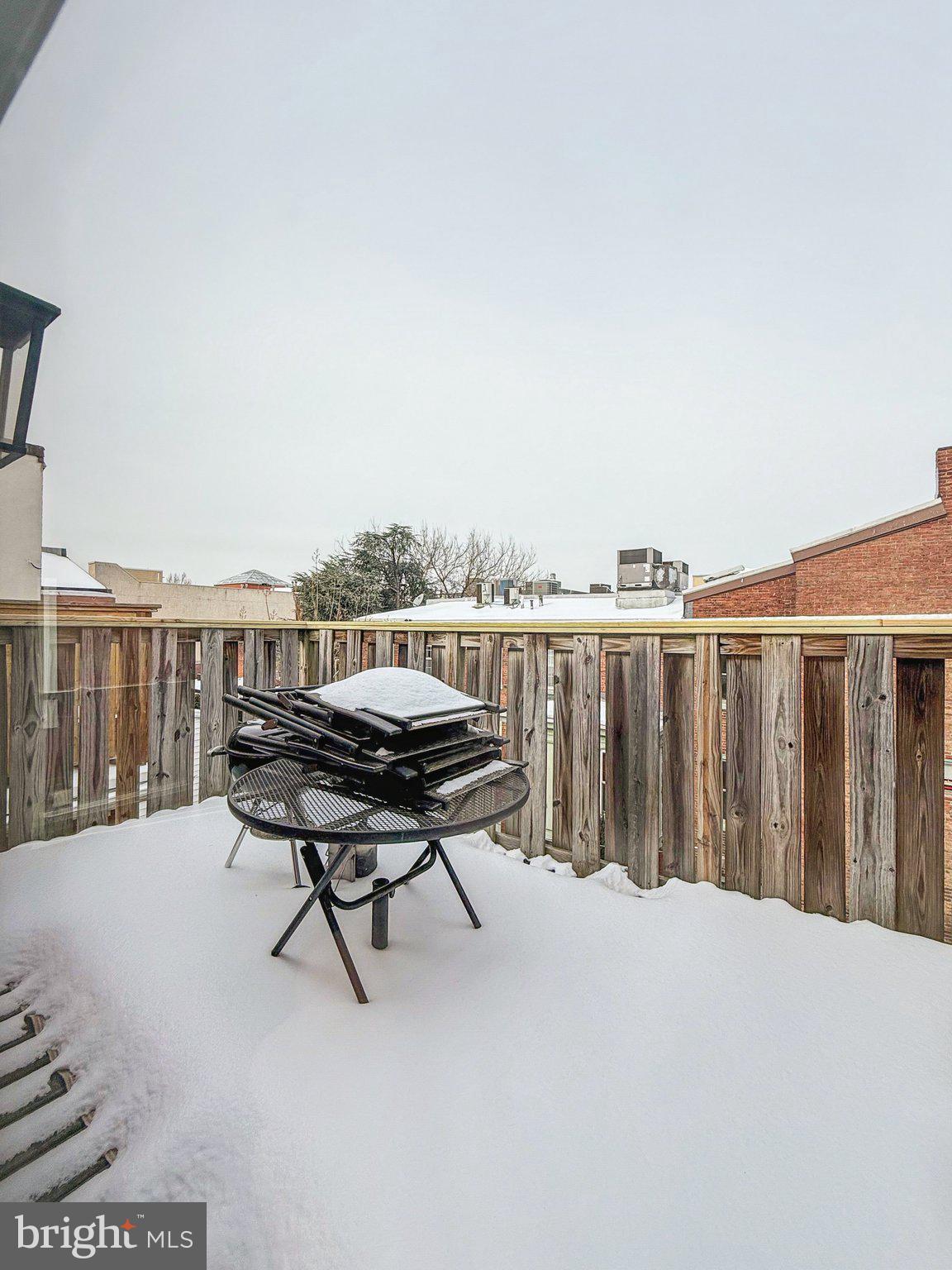1703 Wallace Street, Unit 301 Philadelphia, PA 19130 - Photo 12 of 22 a roof deck with a table and chairs