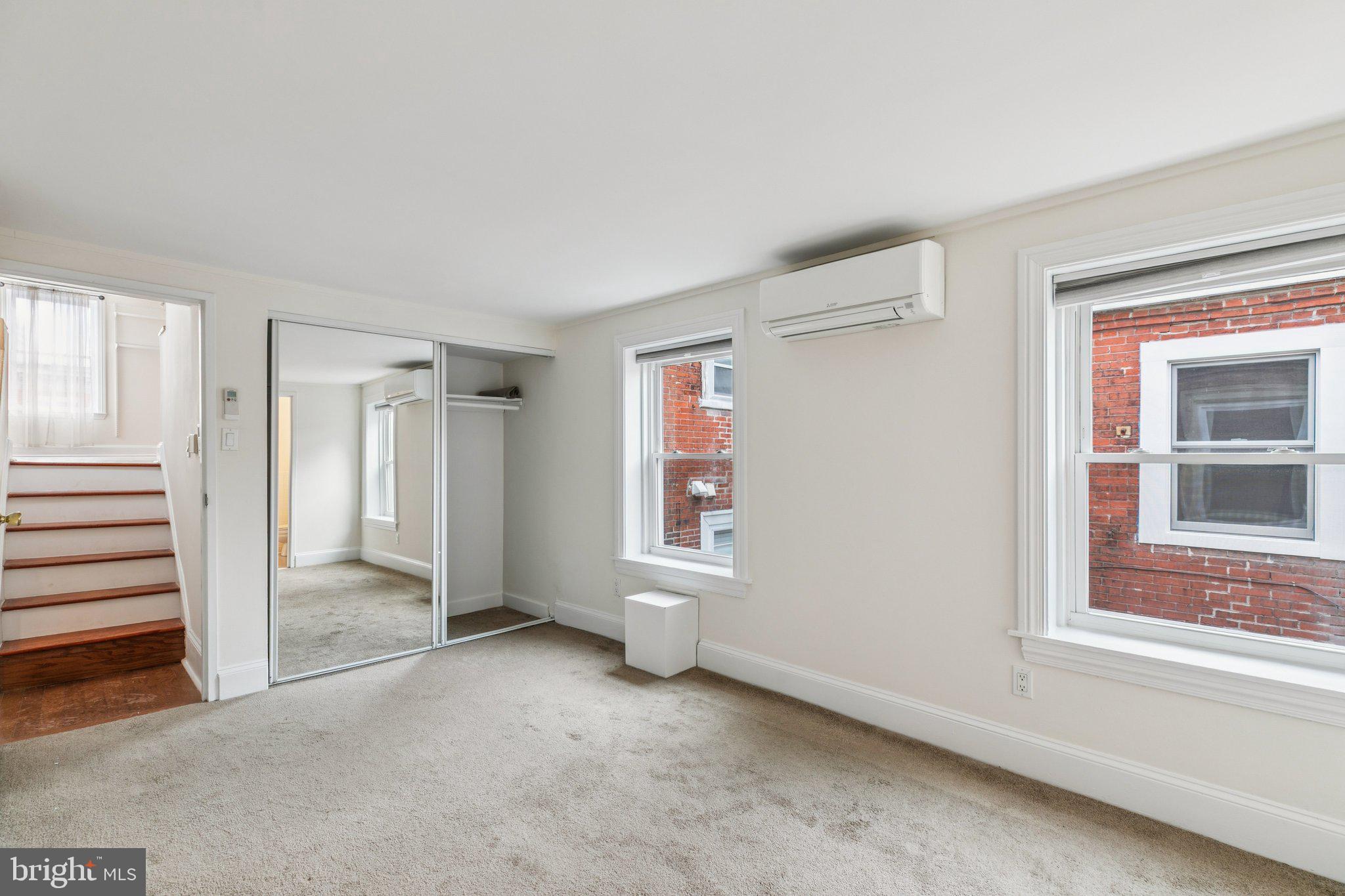 1703 Wallace Street, Unit 301 Philadelphia, PA 19130 - Photo 9 of 22 an empty room with windows