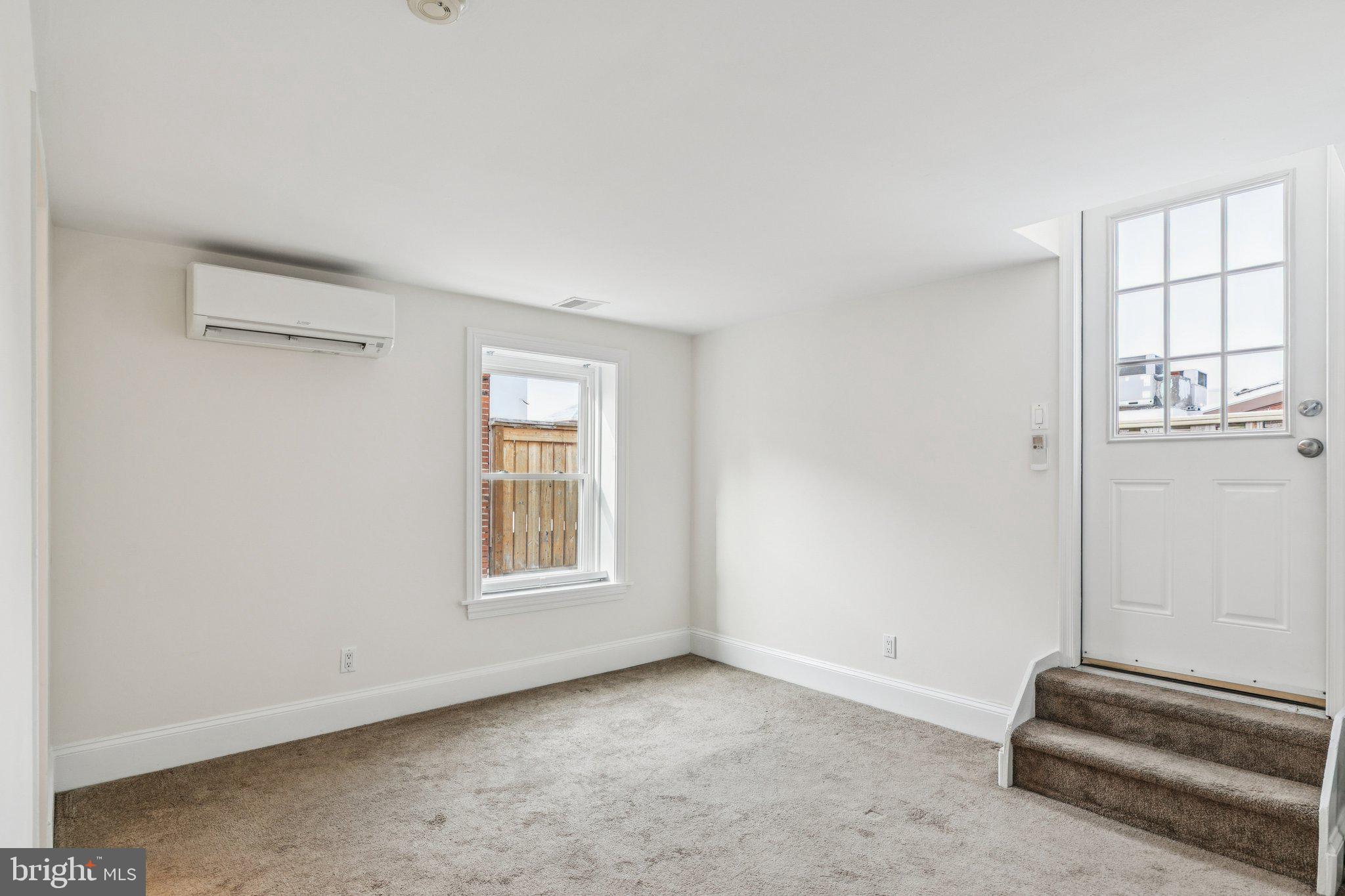 1703 Wallace Street, Unit 301 Philadelphia, PA 19130 - Photo 10 of 22 an empty room with windows