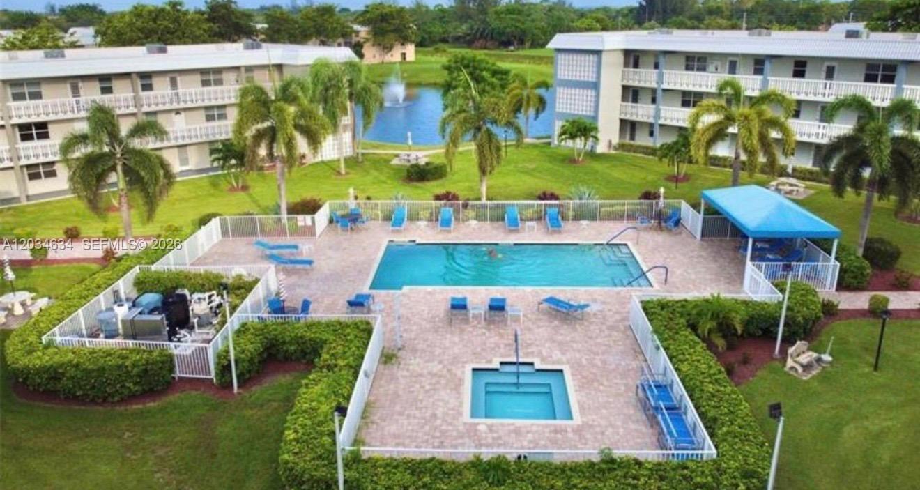 9880 Marina Boulevard, Unit 1516 Boca Raton, FL 33428 - Photo 31 of 32 an aerial view of multiple houses with yard