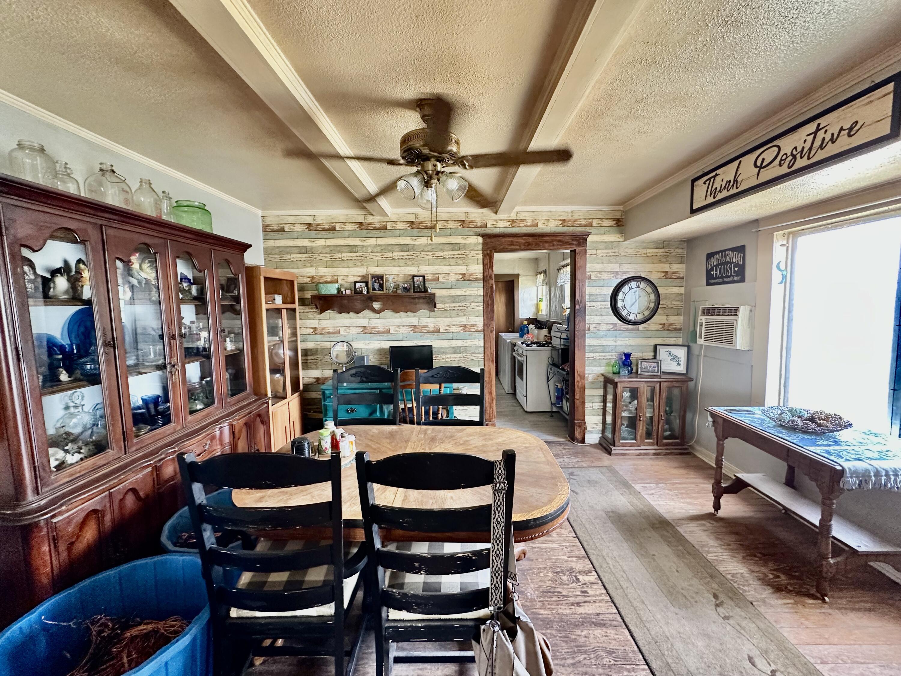 907 Co Road Turkey, TX 79261 - Photo 21 of 24 a living room with lots of furniture and view of kitchen