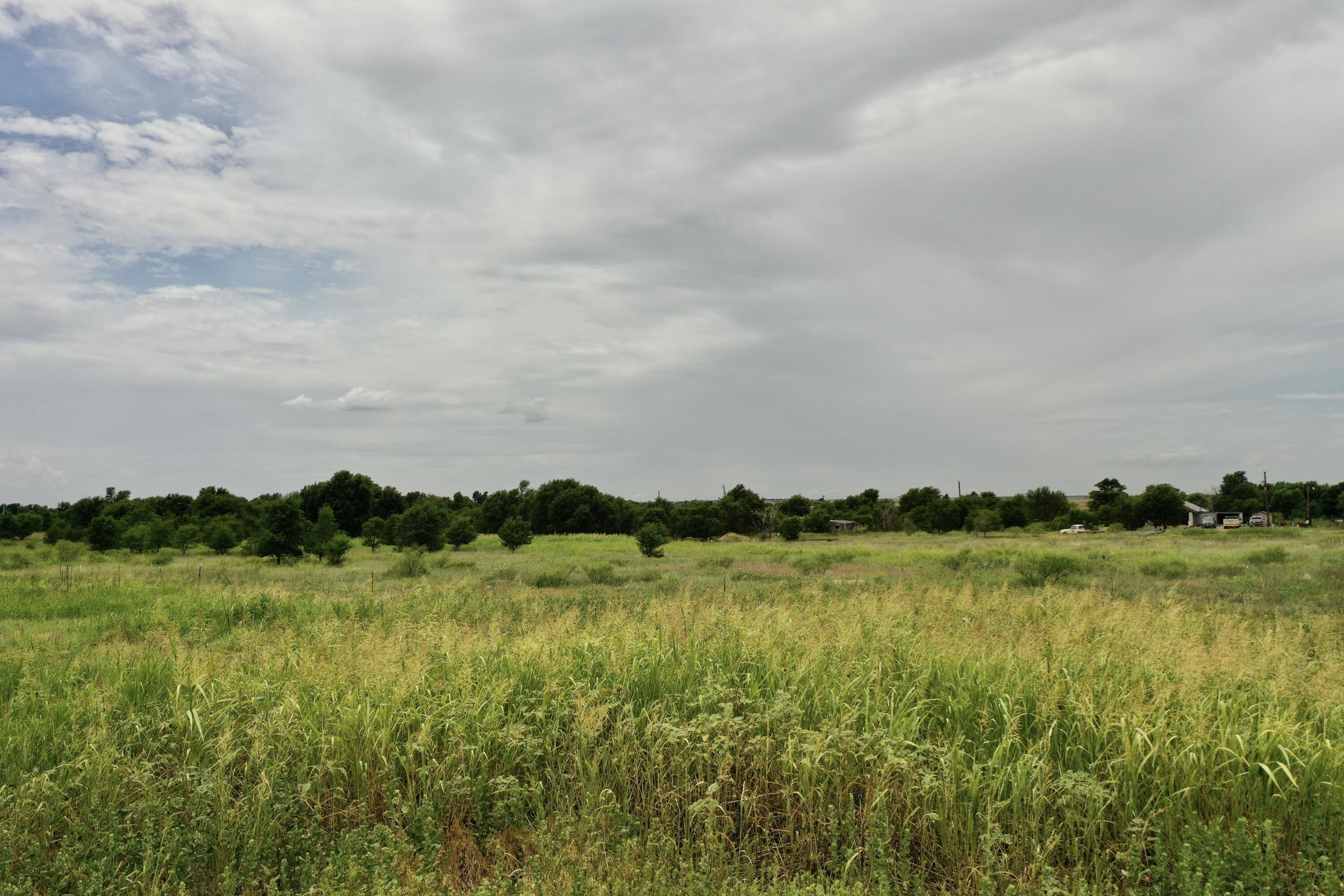 907 Co Road Turkey, TX 79261 - Photo 3 of 24 a view of a lake with houses in the back