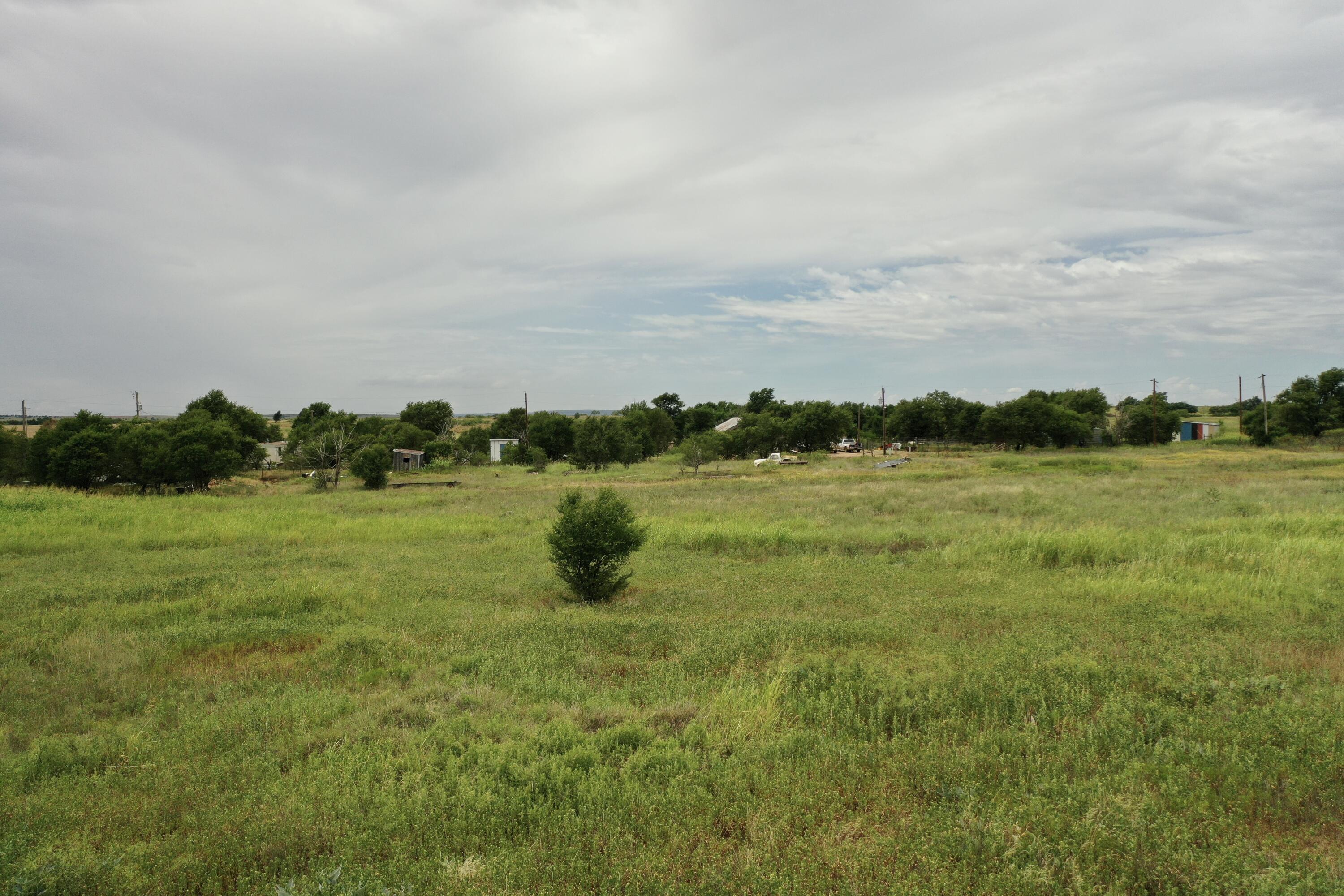 907 Co Road Turkey, TX 79261 - Photo 5 of 24 a view of a lake with houses in the background