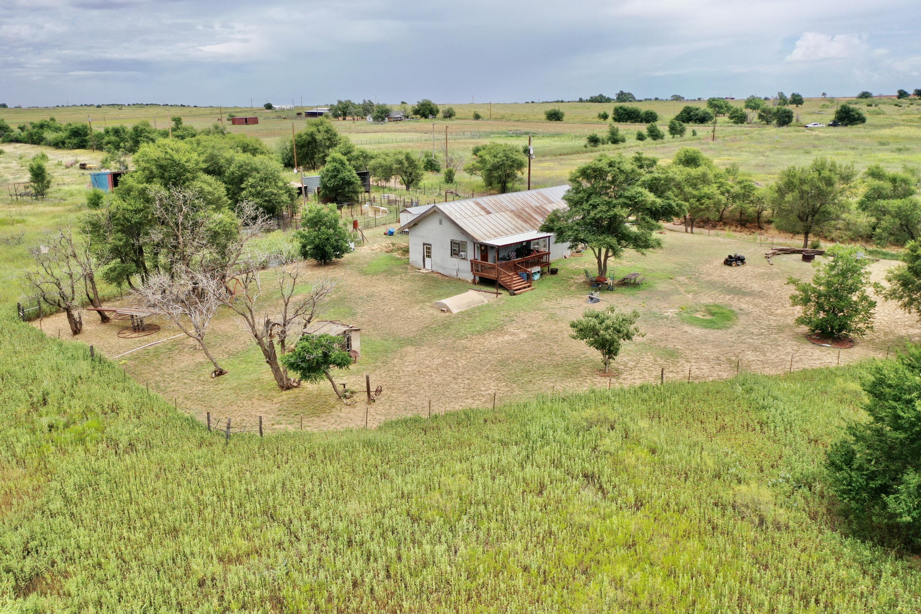907 Co Road Turkey, TX 79261 - Photo 7 of 24 a view of a lake with a yard