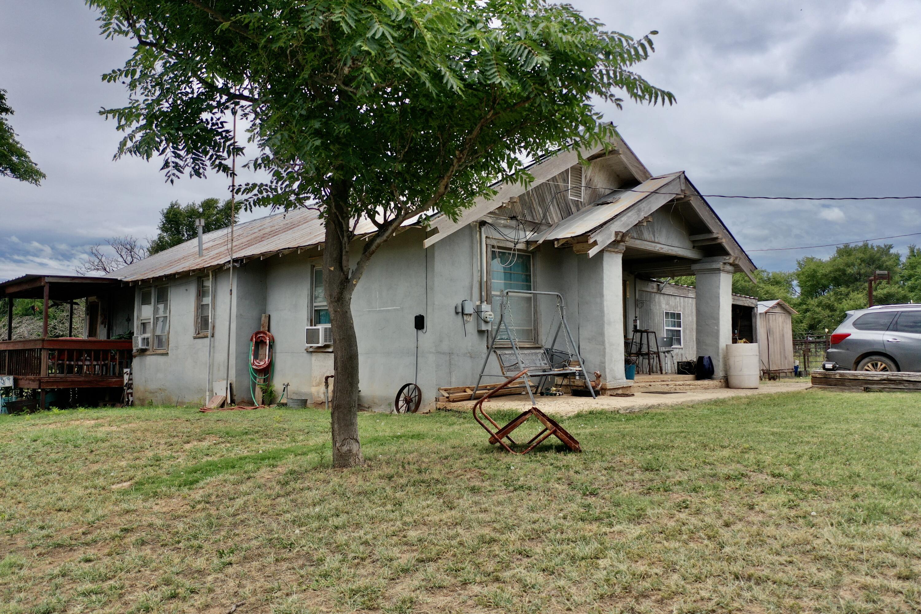 907 Co Road Turkey, TX 79261 - Photo 9 of 24 a view of a house with backyard and sitting area