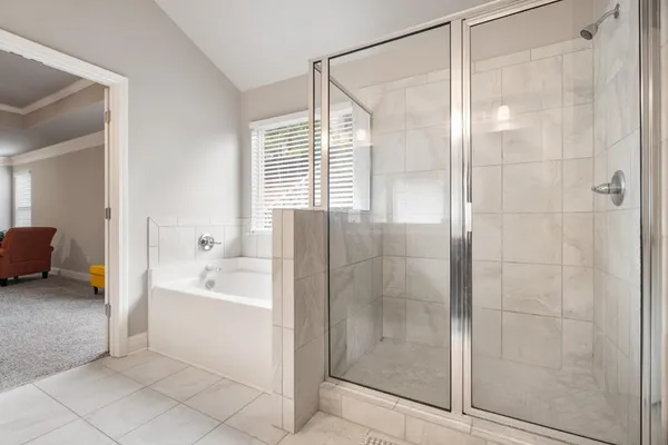 a spacious bathroom with a granite countertop sink and a mirror