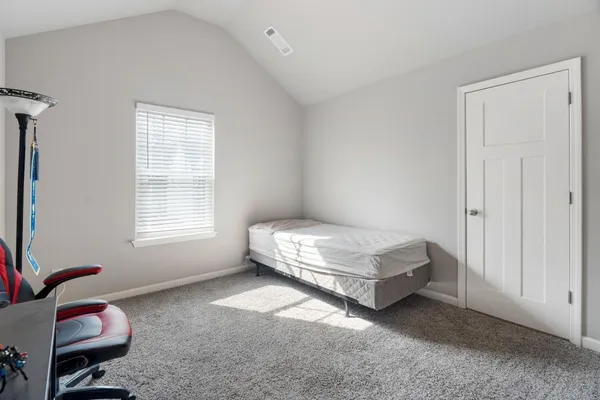 a bathroom with a granite countertop sink a toilet and bathtub