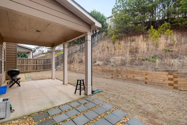 a kitchen with a stove a refrigerator and a sink
