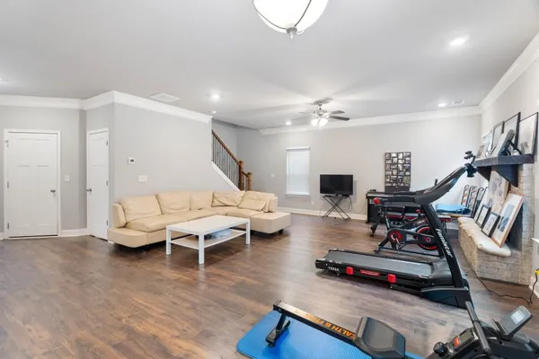 a kitchen with refrigerator and cabinets