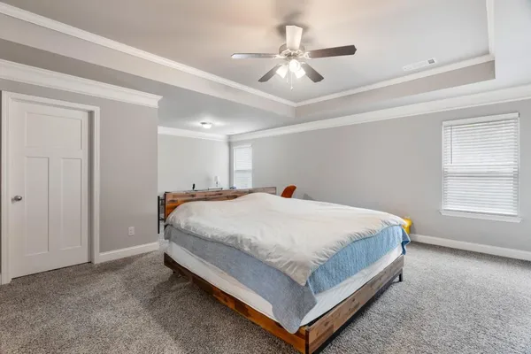 a bed room with a bed and furniture