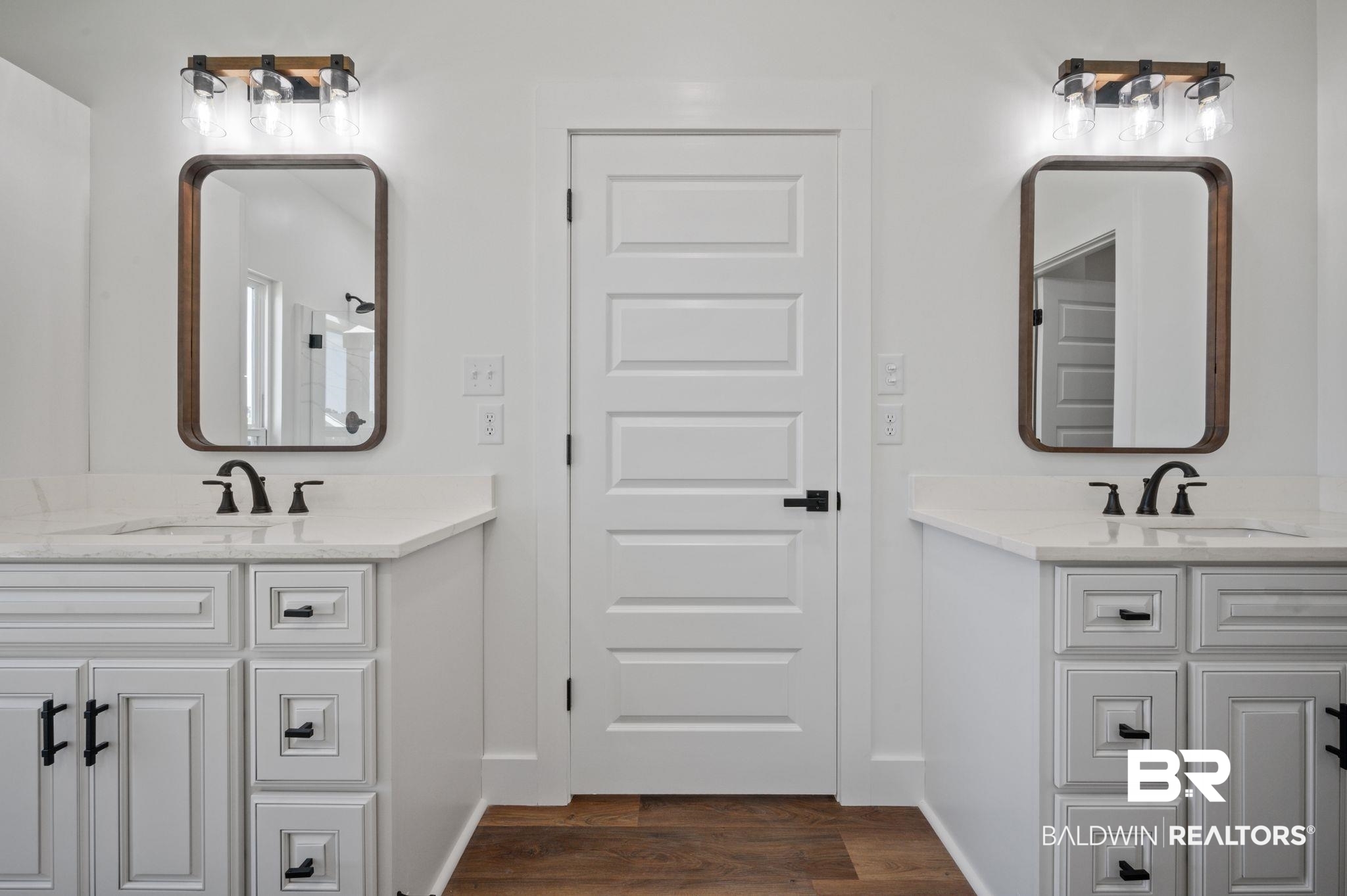 12100 Lott Road Chunchula, AL 36521 - Photo 11 of 21 Bathroom with hardwood / wood-style flooring and dual bowl vanity