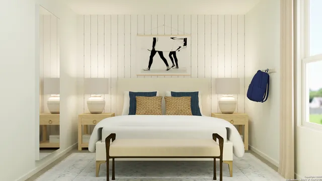 a large bed sitting in a bedroom next to a window