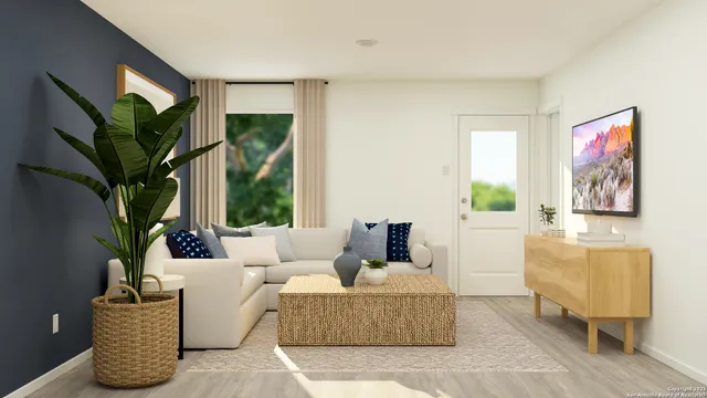 a living room with furniture flowerpot and a window