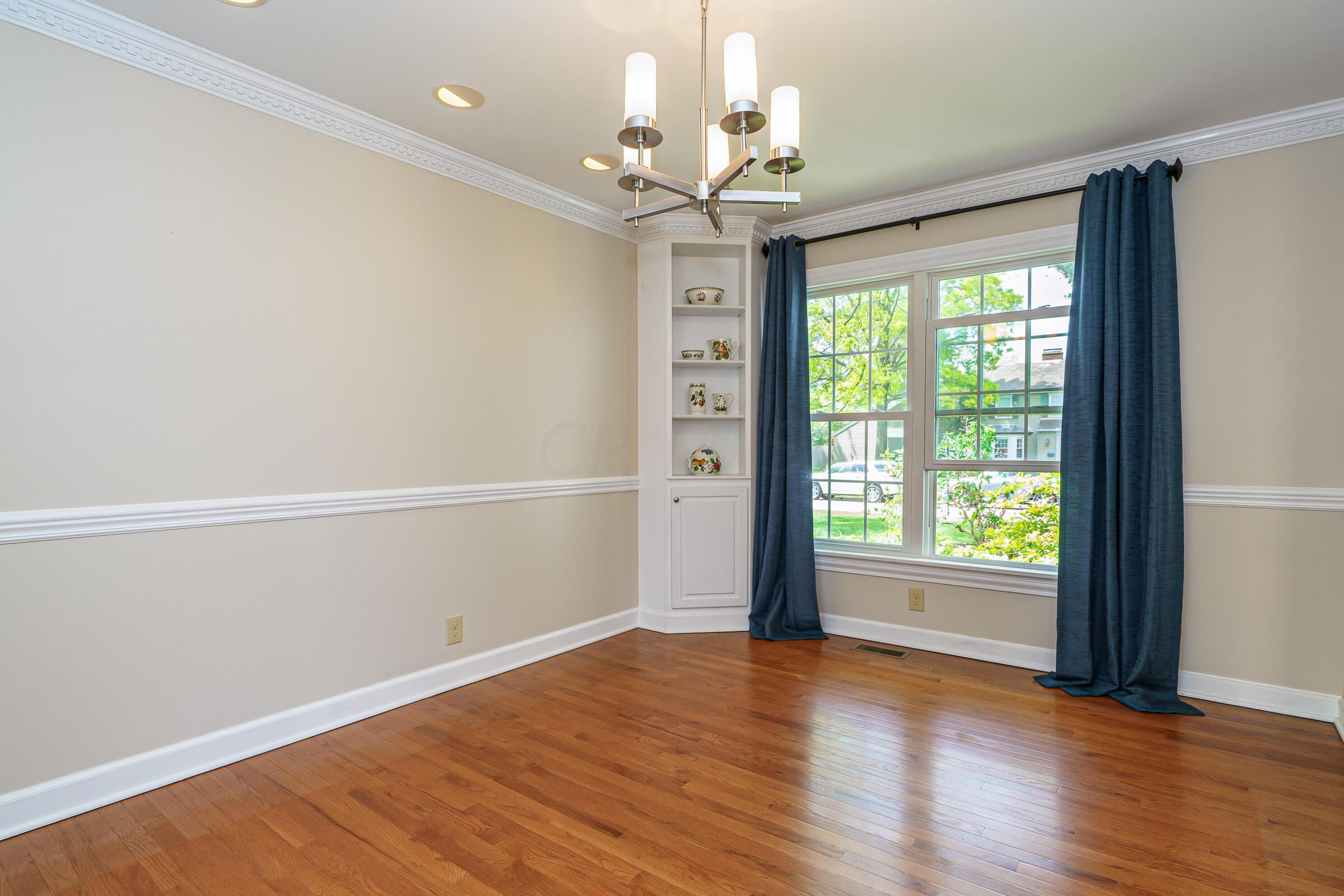 2734 York Road Upper Arlington, OH 43221 - Photo 10 of 40 Elegant dining room with chandelier lighting and updated windows