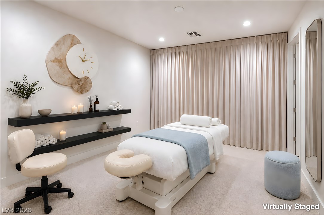 25 Falling Ridge Lane Henderson, NV 89011 - Photo 32 of 48 Unwind in this serene room featuring soft carpeting and elegant recessed lighting.