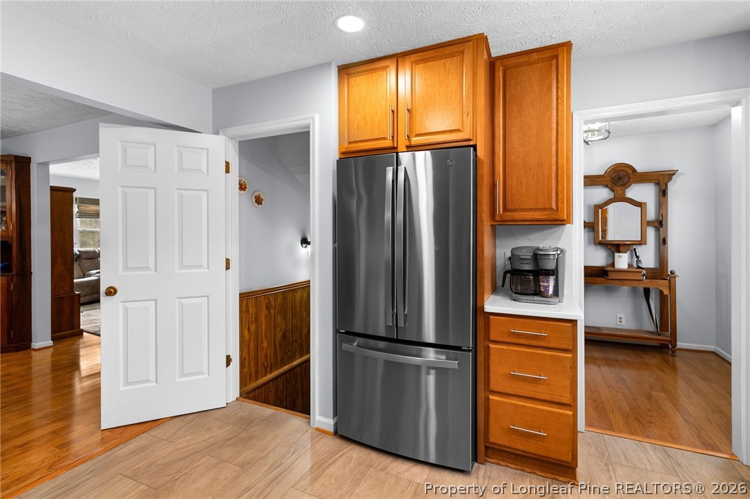 3488 School Road Fayetteville, NC 28306 - Photo 12 of 50 a kitchen with stainless steel appliances granite countertop a refrigerator and a stove top oven