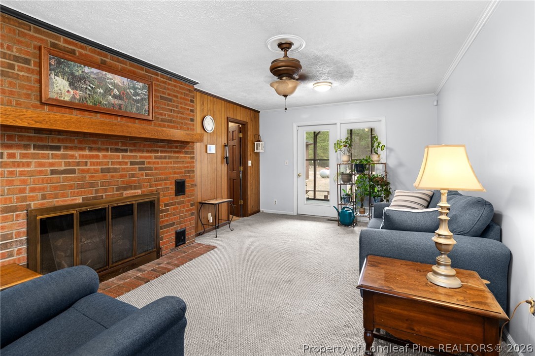 3488 School Road Fayetteville, NC 28306 - Photo 14 of 50 a living room with furniture and a fireplace