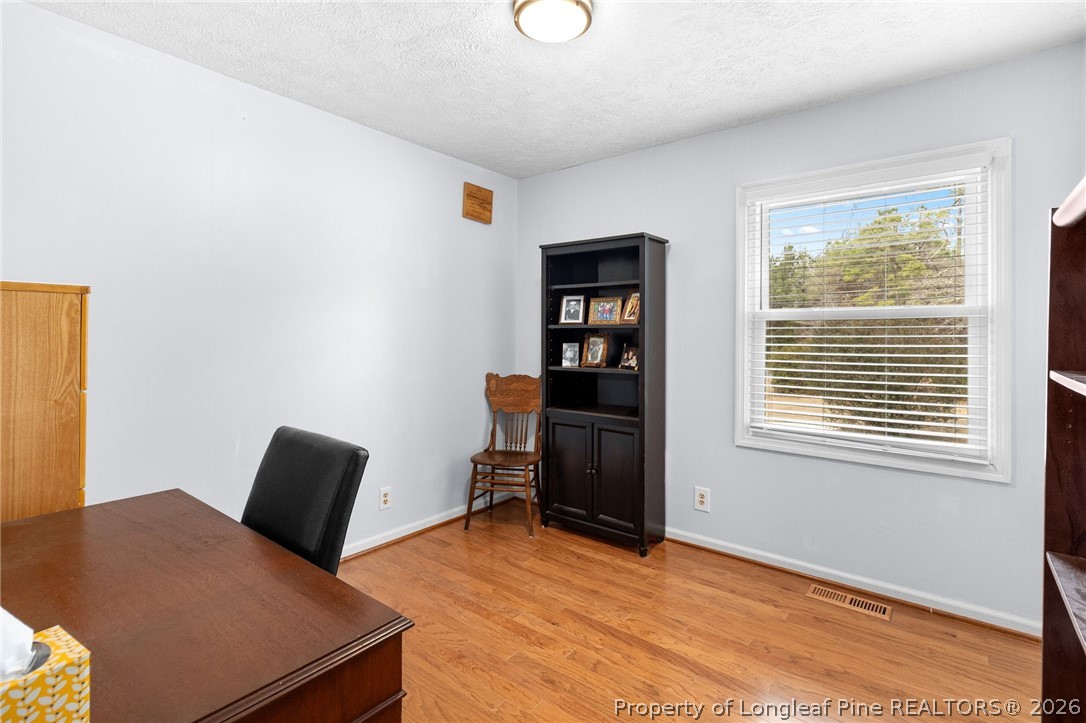 3488 School Road Fayetteville, NC 28306 - Photo 19 of 50 a view of livingroom with furniture and wooden floor