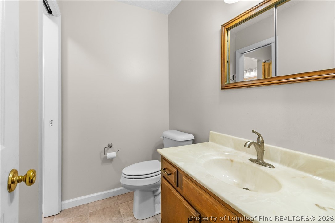 3488 School Road Fayetteville, NC 28306 - Photo 26 of 50 a bathroom with a sink and a toilet