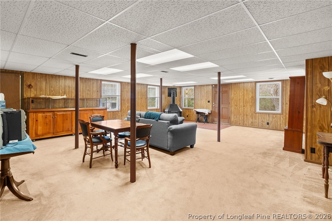 3488 School Road Fayetteville, NC 28306 - Photo 35 of 50 a living room with furniture a dining table and chairs