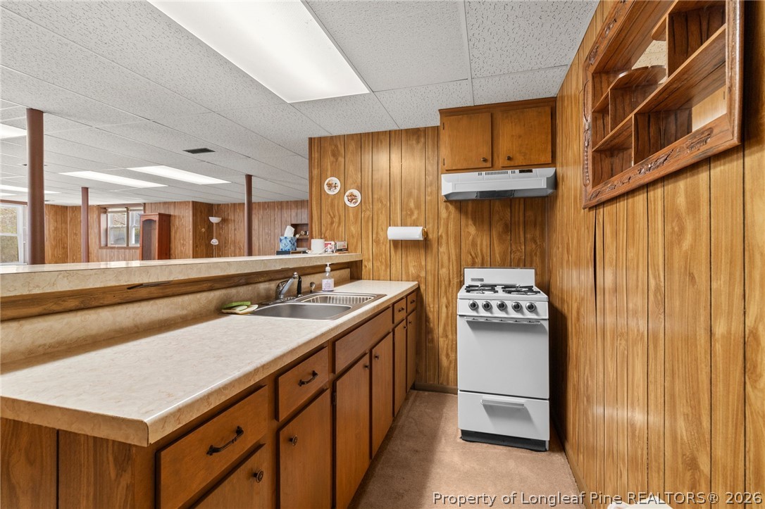 3488 School Road Fayetteville, NC 28306 - Photo 38 of 50 a kitchen with stainless steel appliances granite countertop a sink and a refrigerator