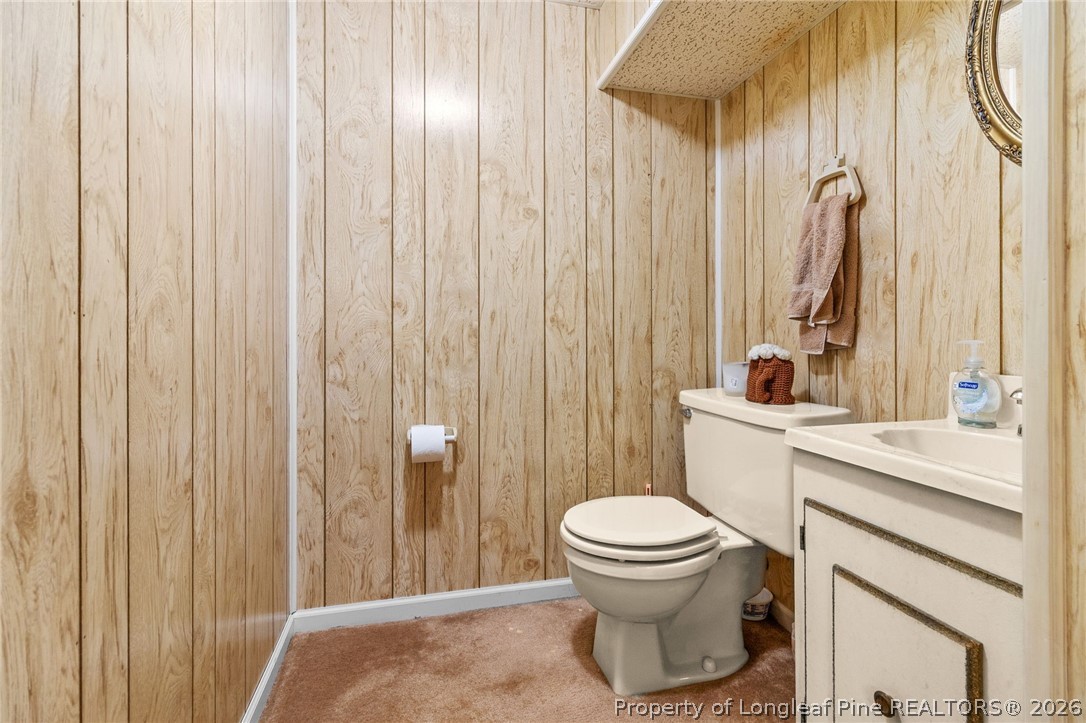 3488 School Road Fayetteville, NC 28306 - Photo 39 of 50 a bathroom with a toilet a sink and a shower