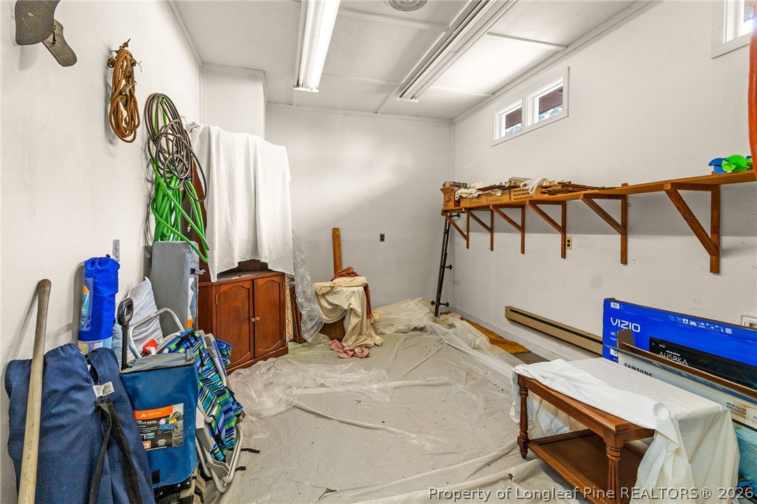 3488 School Road Fayetteville, NC 28306 - Photo 41 of 50 a living room with lots of furniture and a wooden floor