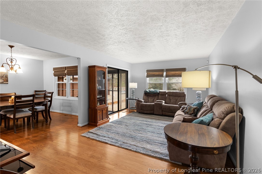 3488 School Road Fayetteville, NC 28306 - Photo 5 of 50 a living room with furniture and wooden floor