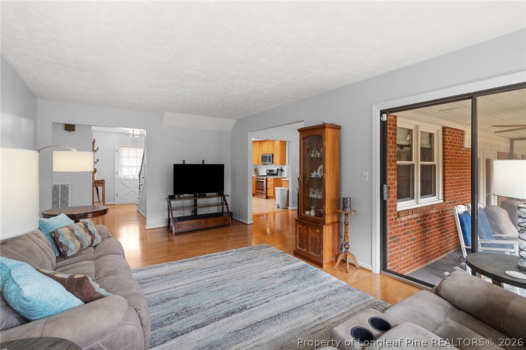 3488 School Road Fayetteville, NC 28306 - Photo 6 of 50 a living room with furniture and a flat screen tv