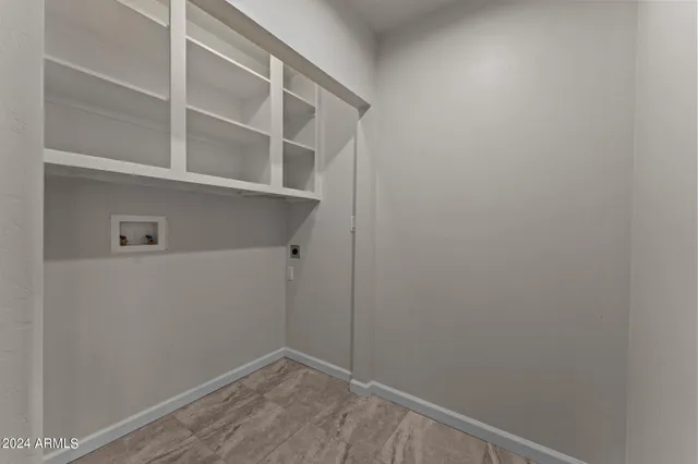 a view of houses with snow on the road