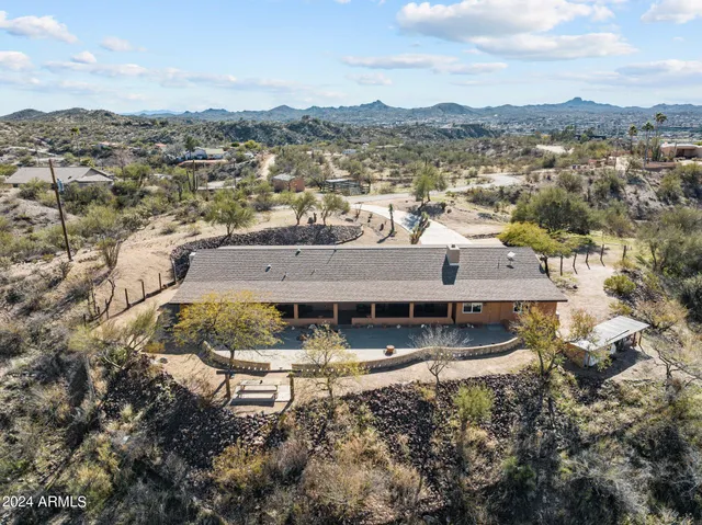 a large kitchen with white cabinets and stainless steel appliances