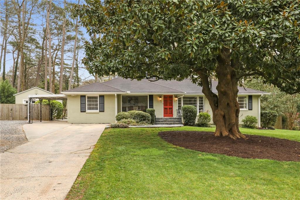 1304 Amanda Circle Decatur, GA 30033 - Photo 1 of 1 a front view of a house with a yard and trees