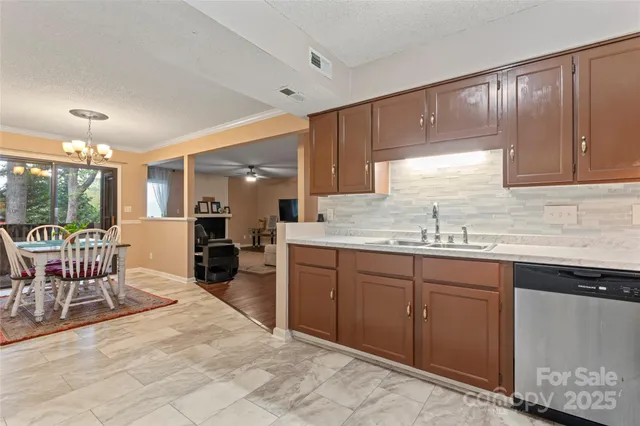 a kitchen with sink cabinets and window