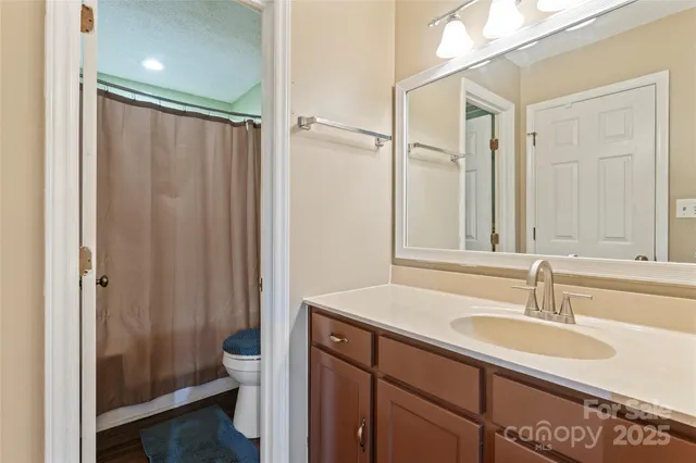 a bathroom with a sink double vanity and a mirror
