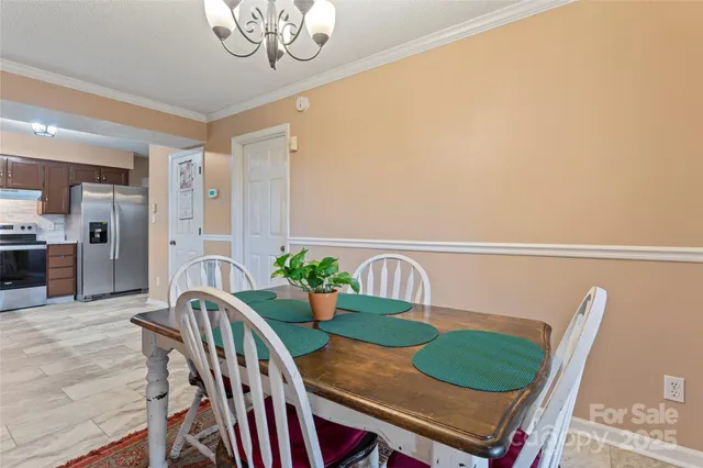 a balcony with table and chairs